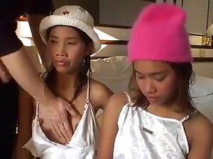 2 junior Thai whores sucking cock