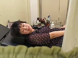 Naughty nurse fucks a Jap babe with her strapon pecker