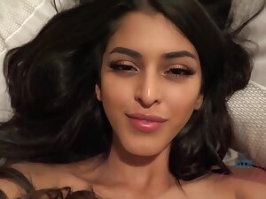 Gorgeous brunette with small boobs, Sophia Leone is smoking and giving a hot, POV footjob