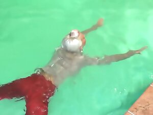 german wetlook with fully clothes swimming