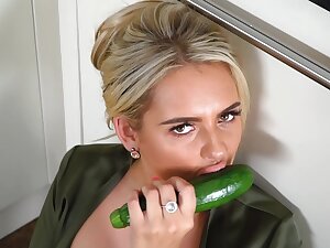 Busty blonde housewife, Katie T is masturbating with a cucumber and enjoying every second of it
