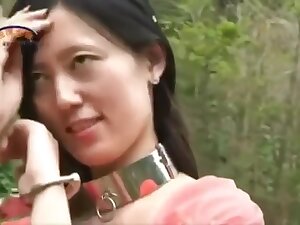 Chinese Beauty In Metal Bondage Outdoors