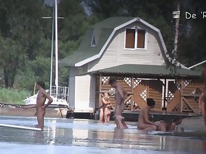 Naked people are having some good time on the beach