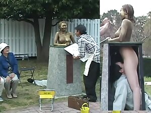 Busty Japanese whore in a kinky public display