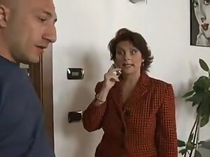 Mature woman pays the repairman.