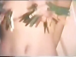 Tied slave slut being used in a vintage fetish vid
