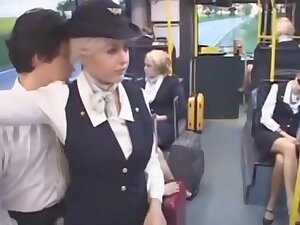 Busty stewardess gives handjob on bus, takes cumshot