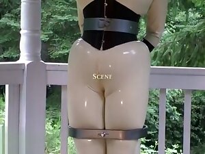 rubber doll jewell in TIGHT corset and white catsuit
